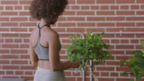 beautiful-black-woman-preparing-yoga-exercise-enjoying-healthy-fitness-lifestyle-in-modern-office-african-american-female-with-funky-afro-hairstyle