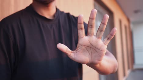 man showing stop gesture