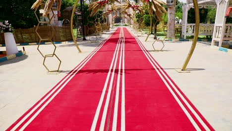 Outdoor-wedding-arch-decorations-in-a-garden---camera-tilt-up