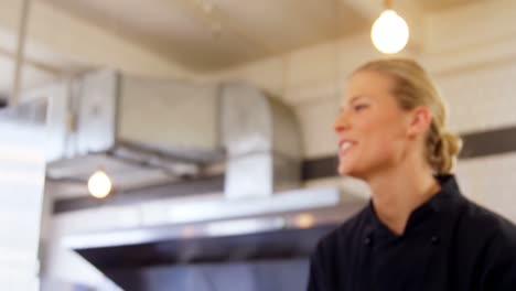 Waitress-ringing-order-bell-at-counter-4k