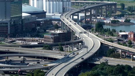 An-aerial-view-of-the-city-of-Buffalo,-New-York-and-its-infrastructure-of-bridges-and-buildings-beside-Lake-Erie