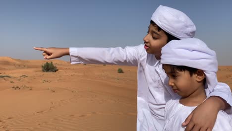 two children play in desert