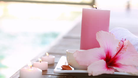 beauty treatment in bowl presented on plate with flower