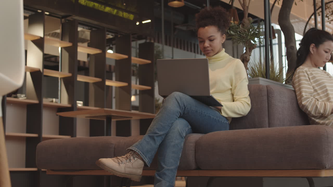 Women Sitting in Hotel Lobby