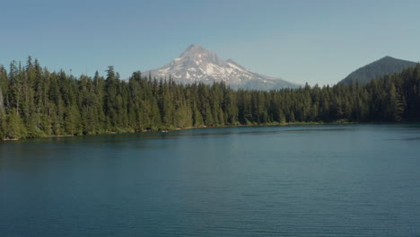 Low-aerial-slider-shot-of-Mount-Hood-over-a-Lake