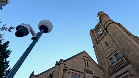 clock tower and security camera at university building