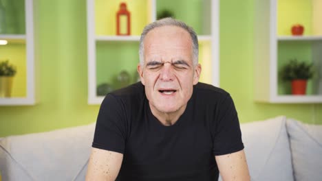 the old man is sweating from illness. high fever problem.