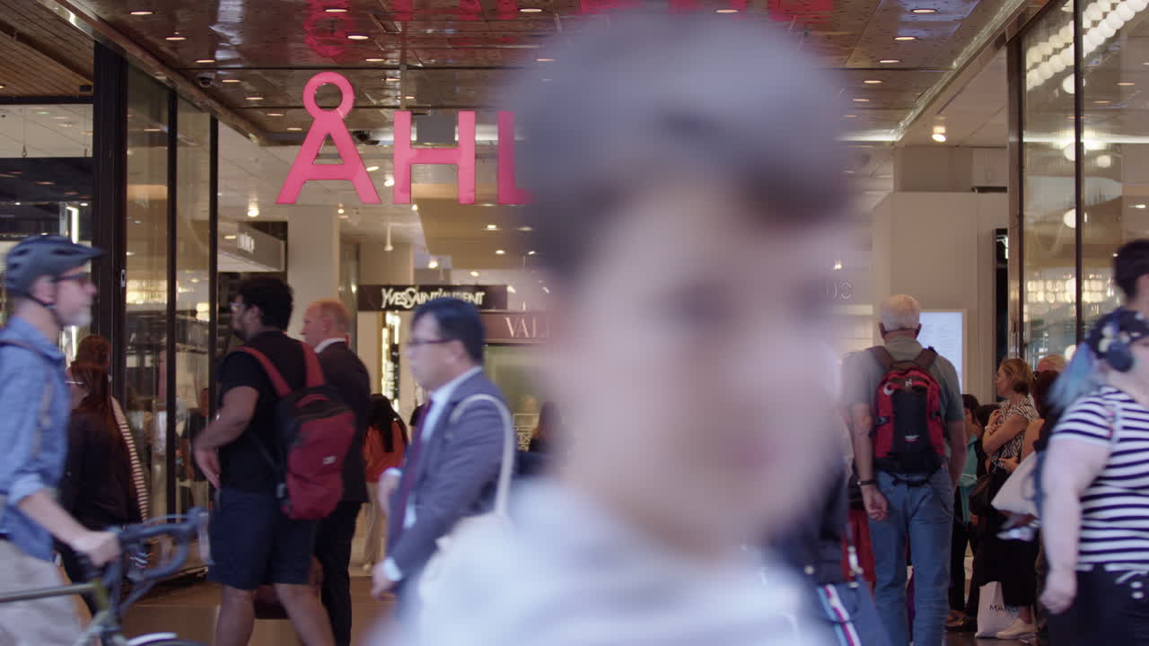 Busy Ahlens department store in Stockholm with lots of shoppers walking around
