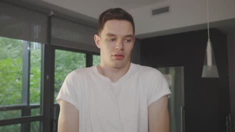 closeup of a man doing shoulder rotation warm up exercises