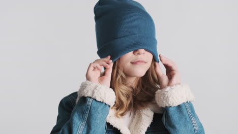 teenage caucasian girl wearing denim jacket and fooling around.