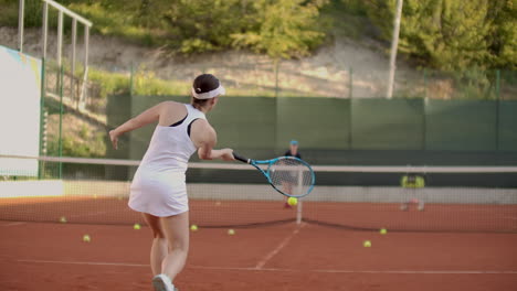 a tennis player prepares to serve a tennis ball during a match. slow motion