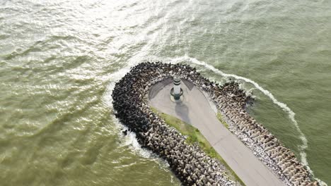 Aerial-view-approaching-the-lighthouse-of-Farol-Do-Molhe-Da-Barra-De-Itajai,-Santa-Catarina,-Brazil