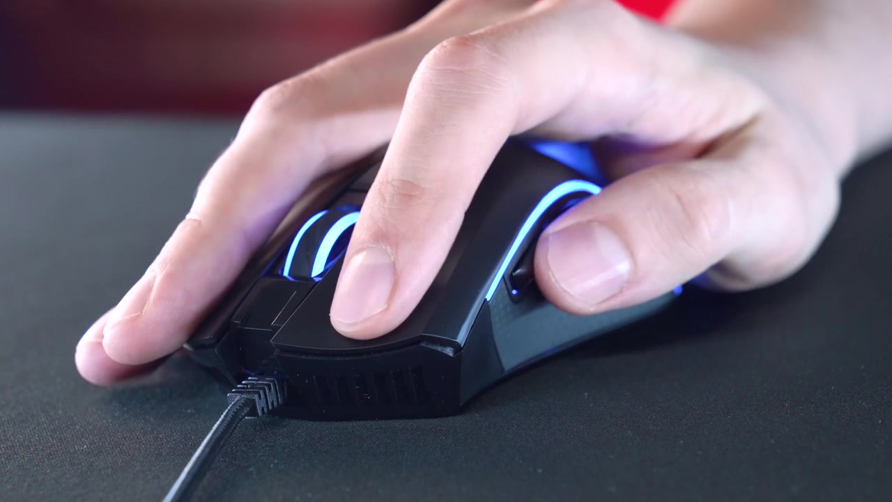 Close-up of Hand Clicking and Scrolling a Gaming Computer Mouse