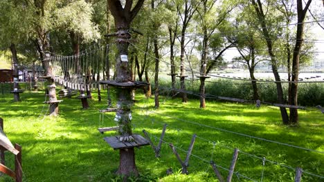 Small-high-ropes-course-in-small-grove-of-trees,-Varbo,-Hungary