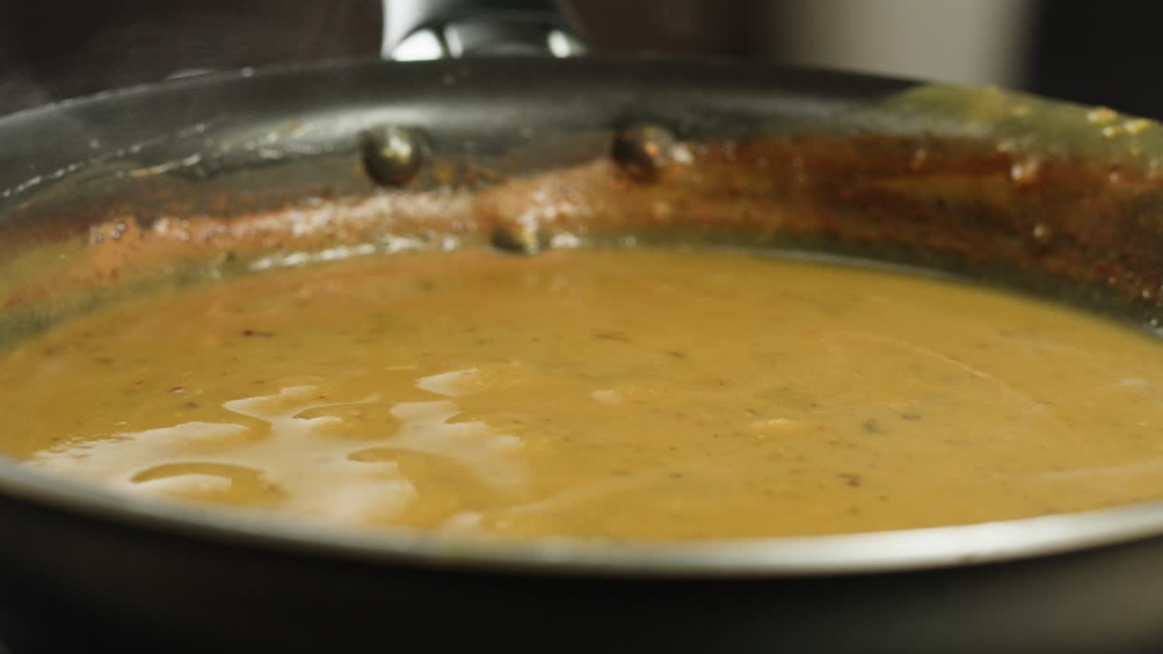 A vibrant platter featuring a variety of traditional Indian dishes, including curries, chutneys, and flatbreads.