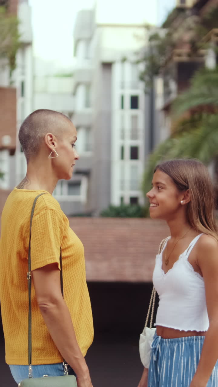 Mother and Daughter Stroll Through City