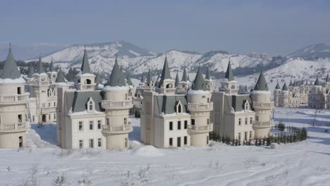 drone flying towards close-up of abandoned disney fairy castles burj al babas