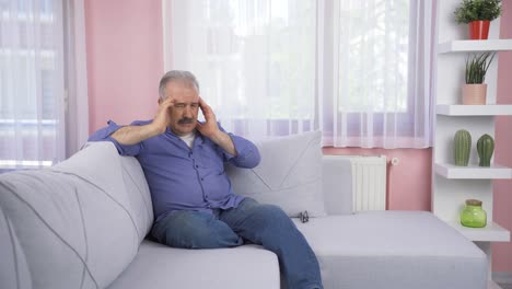 Worried-and-nervous-old-man-at-home-watching-outside.