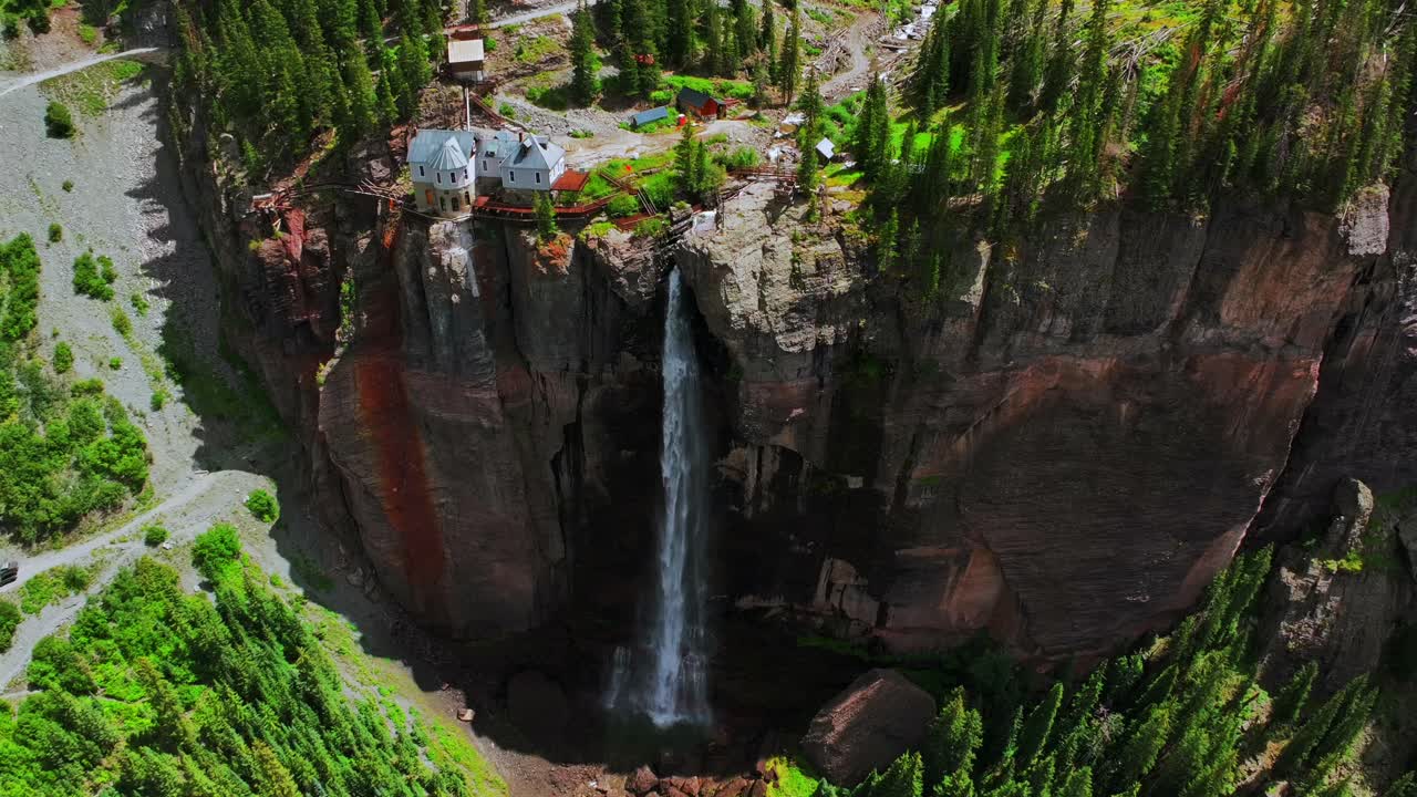 Summer green Telluride Bridal Veil Falls Waterfall Colorado powerplant house aerial drone Box Canyon Black Bear Pass Road Rocky Mountains 4wd hiking blue sky cliffs Uncompahgre Forest birdseye circle
