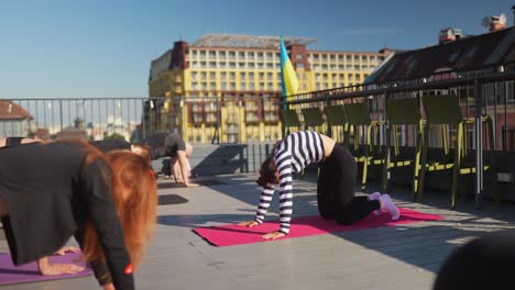 group yoga class on a rooftop
