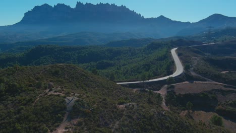 Tourist-takes-photos-of-Bosque-de-las-cruces-and-Montserrat,-Barcelona