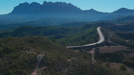 tourist takes photos of bosque de las cruces and montserrat, barcelona