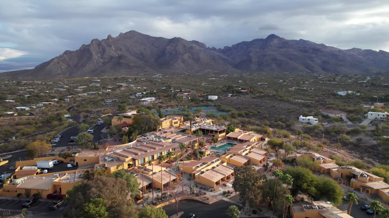 Desert oasis resort and pool, aerial shot, 4K