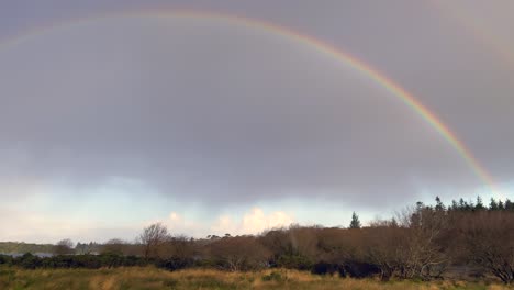 full rainbow visible over killarney national park.
