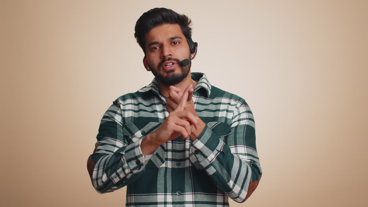 Man wearing headset freelance worker call center support service operator helpline communication