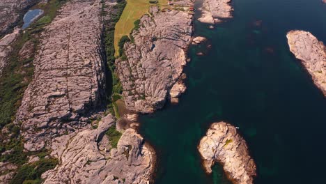 rocky coastline and turquoise waters in norway's rugged nature, aerial view