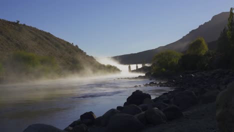 misty river valley at sunrise