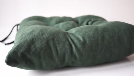 dark green square fabric cushion