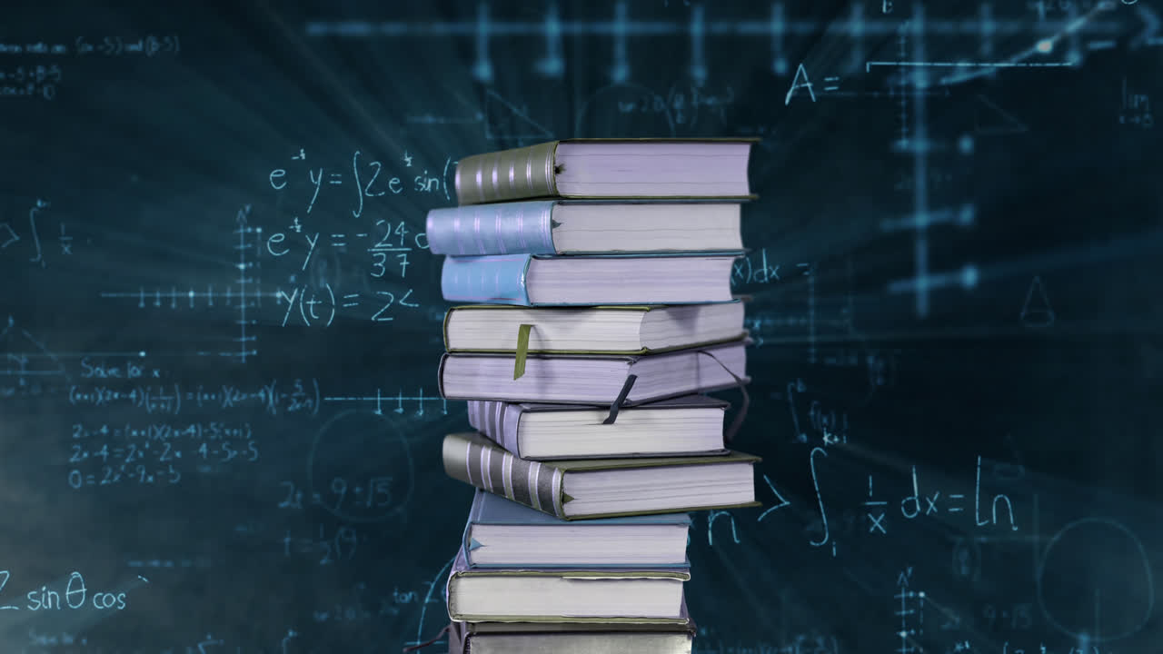 Pile of books and mathematical equations and graphs
