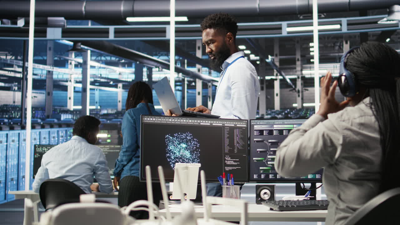 Happy data center admin uses node tree programming on laptop