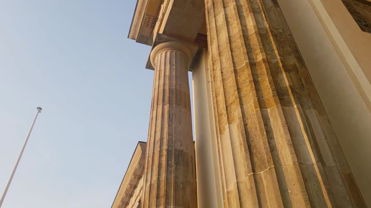 Slow motion Brandenburg Gate concrete high columns in Berlin during sunset