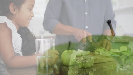 Animation-of-happy-biracial-family-cooking-over-apples