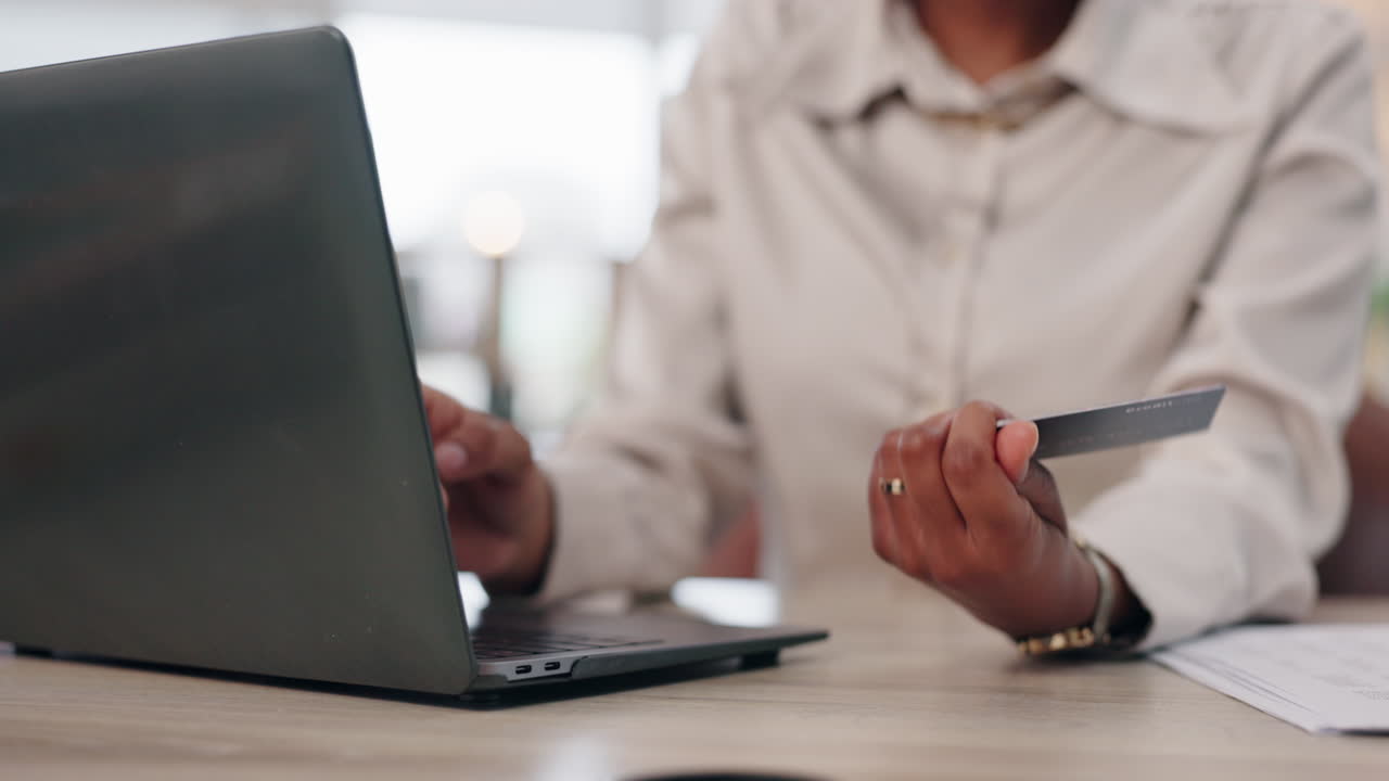 Woman using laptop for online shopping with credit card