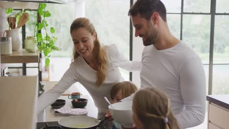 Family-preparing-food-in-kitchen-at-home-4k