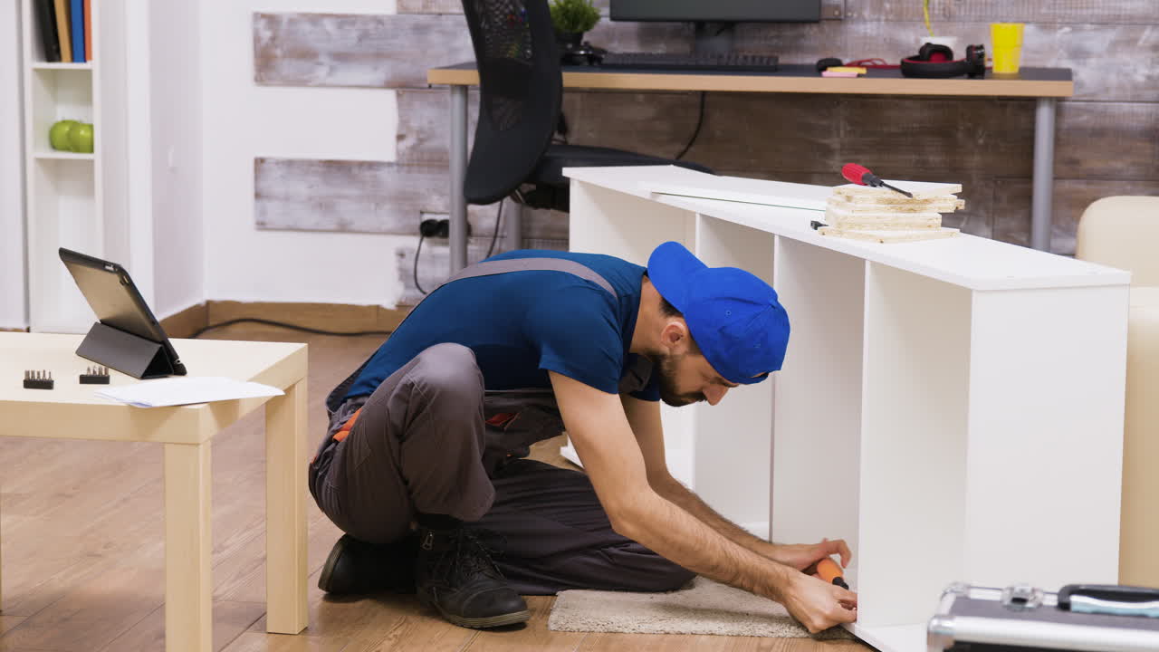 Man assembling furniture at home