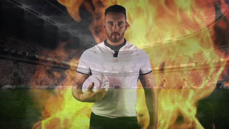 rugby player with fake fire in a stadium