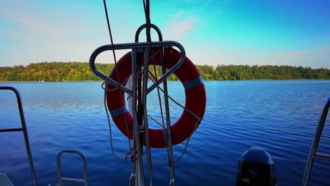 the front bow of a white sailing boat with blue sky and sea background