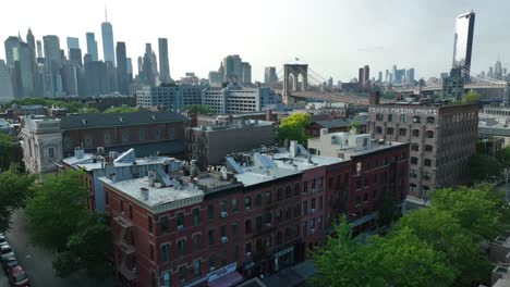 Cinematic-drone-shot-of-residential-area-in-Beautiful-Brooklyn-Heights-and-skyline-of-Manhattan-in-background-during-dusk---aerial-orbiting-shot