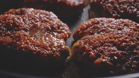 frying burger patties made of ground turkey meat