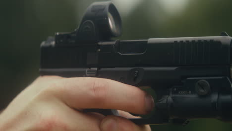 a handgun with an optic sight