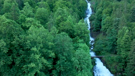 Drone-flight-over-a-stunning-alpine-mountain-water-fall-1