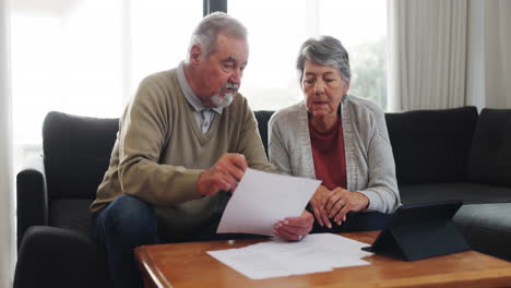 Senior-couple,-talking-and-tax-documents