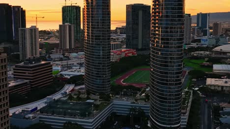 aerial footage of oahu's cityscapes during golden hour
