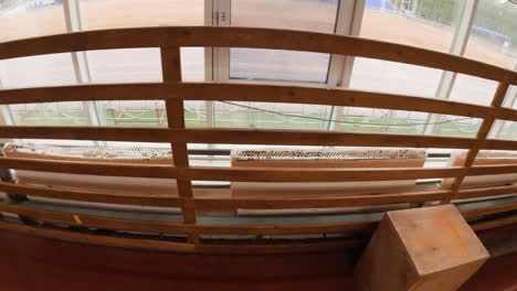 personal perspective from a gym overlooking an outdoor stadium