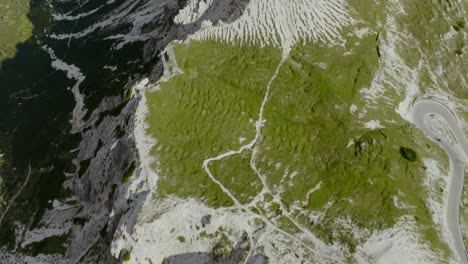 Aerial-Tilt-up-drone-shot-of-the-valley-in-Dolomites-Alps,-the-Tre-Cime-di-Lavaredo-Italy,-4k