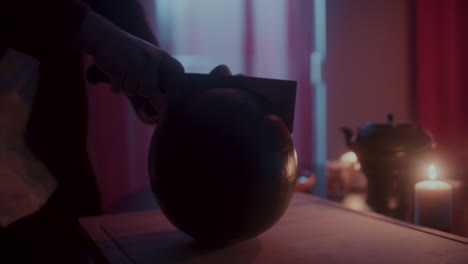 person cutting watermelon